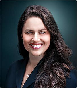 Headshot of a woman in a dark suit