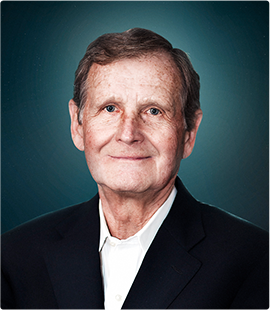Headshot of a man in a dark suit