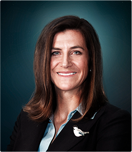 Headshot of a woman in a dark suit