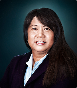 Headshot of a woman in a dark suit